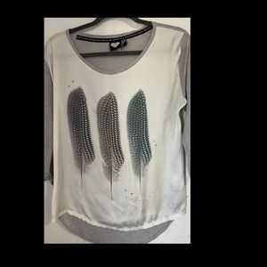 Catwalk Junkie long sleeve feather design top.